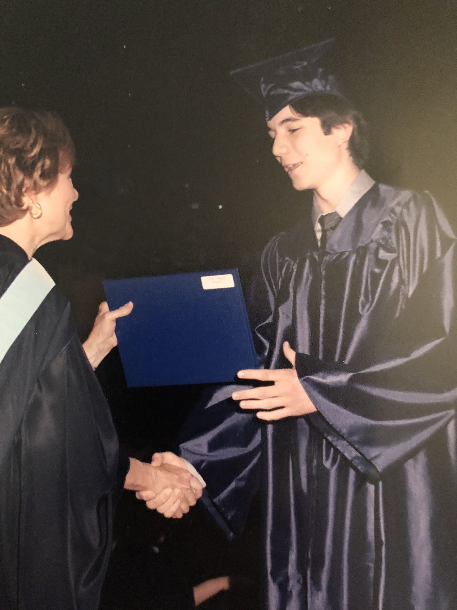 Vlad Tenev receiving his diploma at the TJHSST commencement, 2004